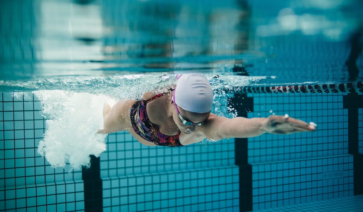 Fit female swimming in pool