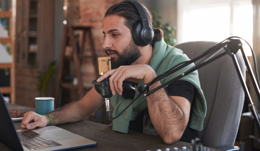 man wearing headphones starting online streaming