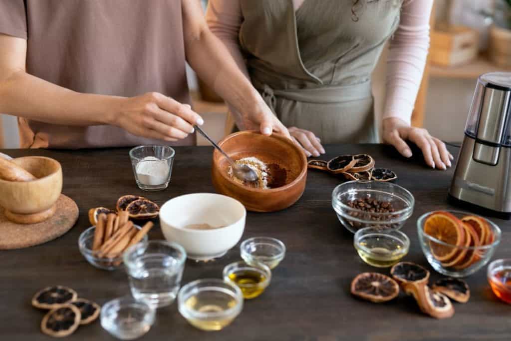 woman mixing ingredients for candied fruit in a bowl