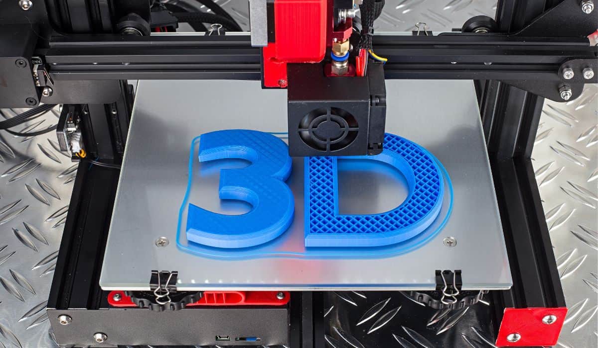 3D printer printing blue logo symbol on metal diamond plate