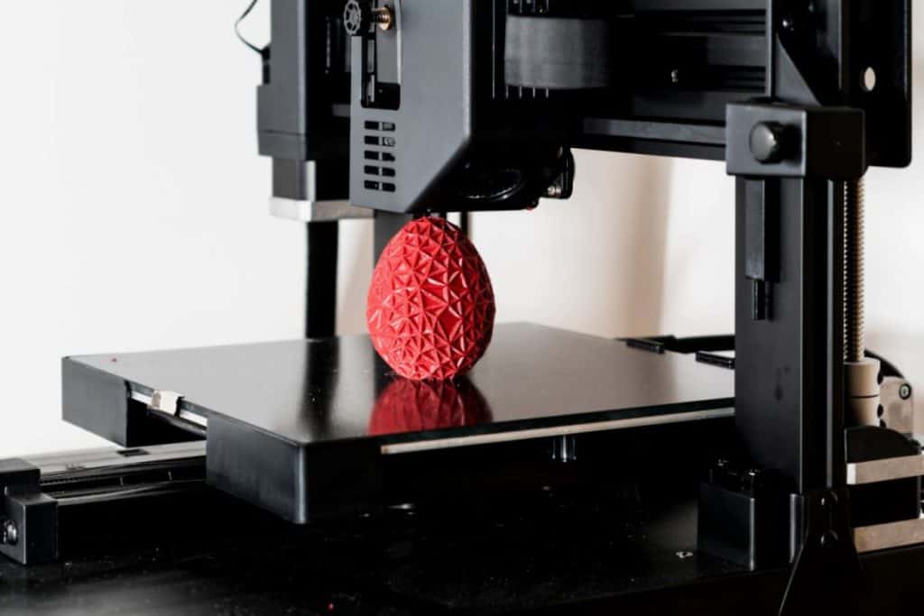 3D printing machine printing a 3D egg 