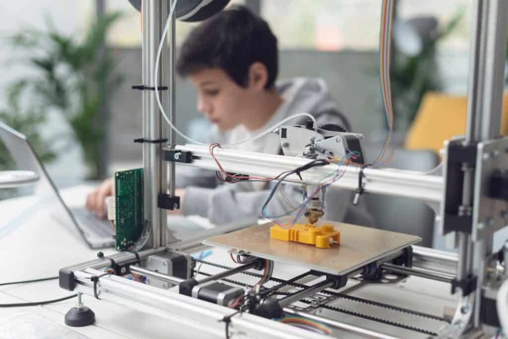 A boy doing and learning 3D printing as a hobby 