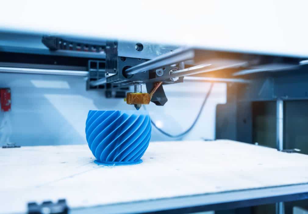 Blue object on 3D printing machine
