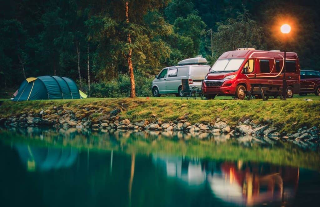 rv parking near the lake in a park