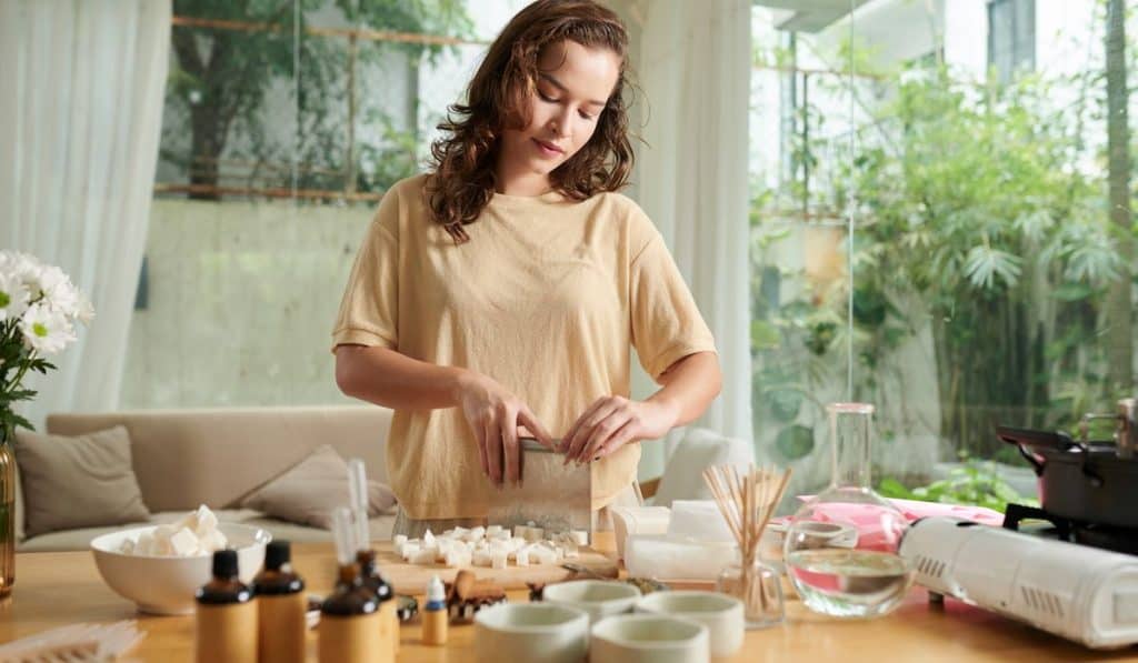 woman making an organic soap from scratch