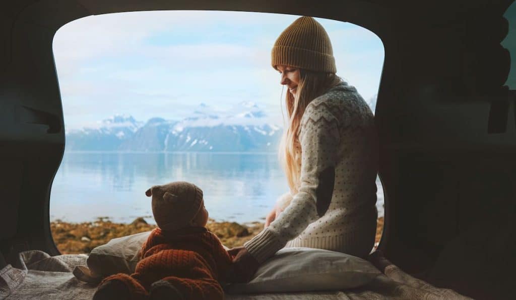 mom with baby inside a tent with a wonderful view