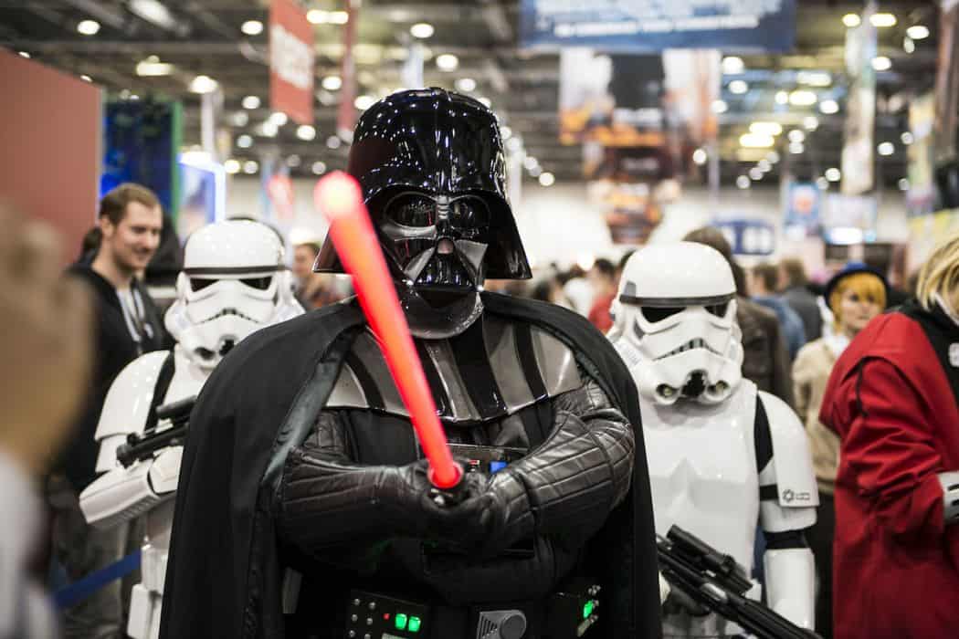 Darth Vader and Storm Troopers pose at the London Comicon MCM Expo
