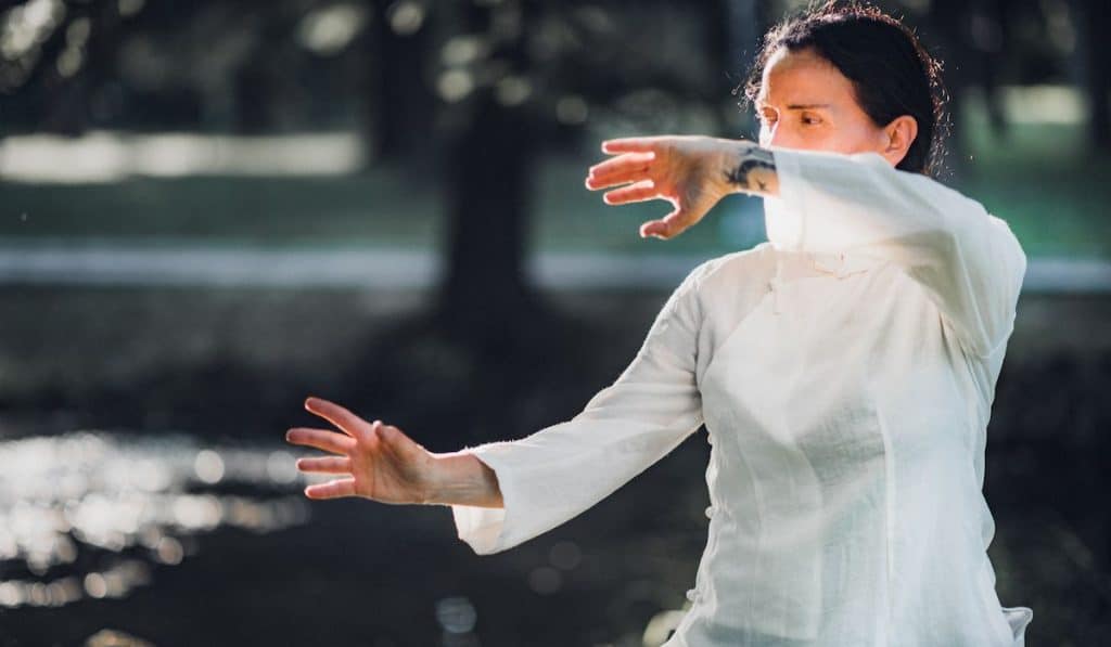 woman practicing tai chi during the morning