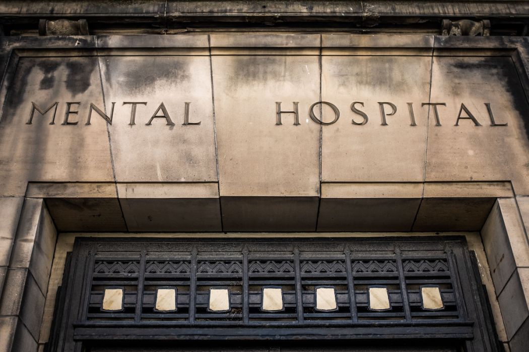 Entrance And Sign For A Scary Victorian Era 'Mental Hospital