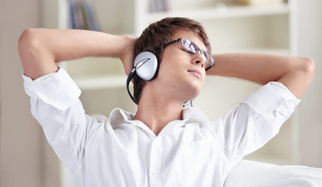 guy relaxing and listening to music 