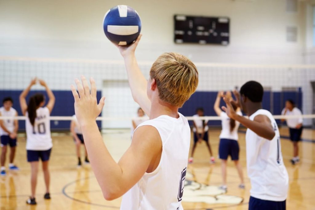 volleyball match in gymnasium