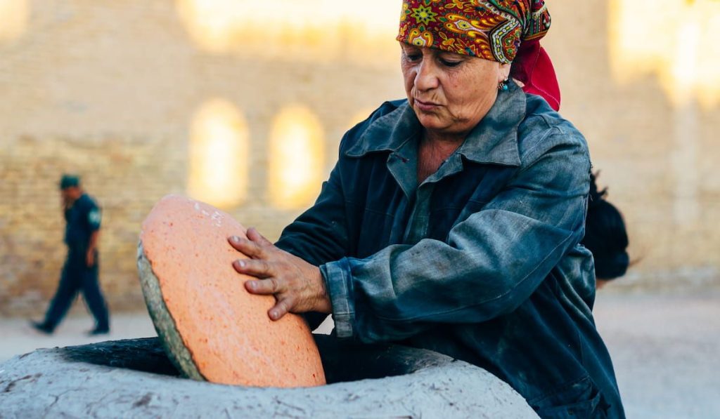 woman making traditional tandoori bread 