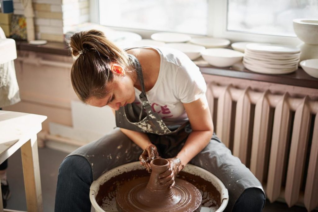 woman making ceramic pottery 