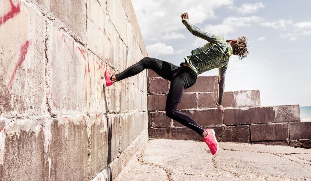 young man doing free running