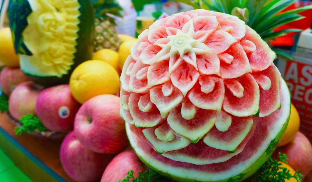 red and yellow watermelon carving display