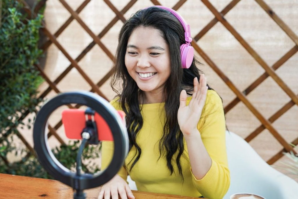 girl streaming online using her mobile phone