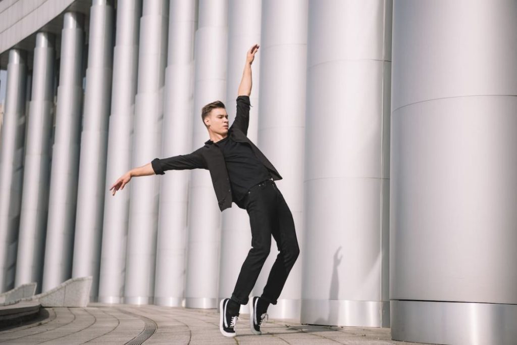  young man dancing outside the building