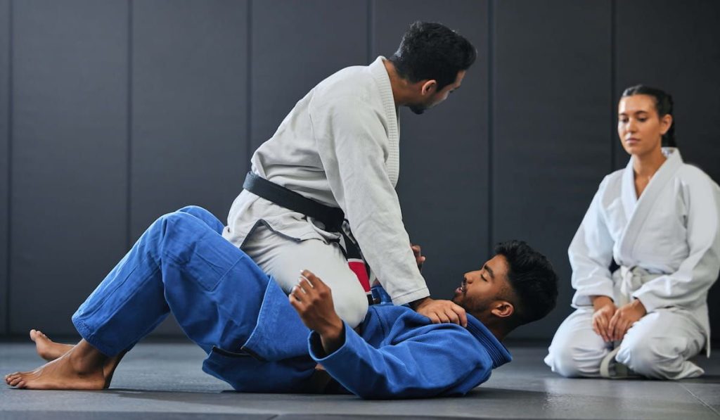 martial arts instructor teaching a lesson on fighting and defense training 