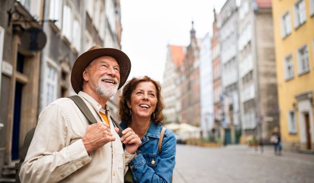 senior couple tourist enjoying exploring a country's historic town