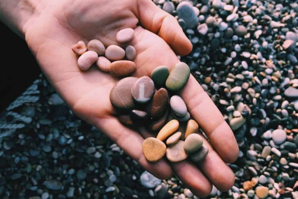 Collecting pebbles on the beach 