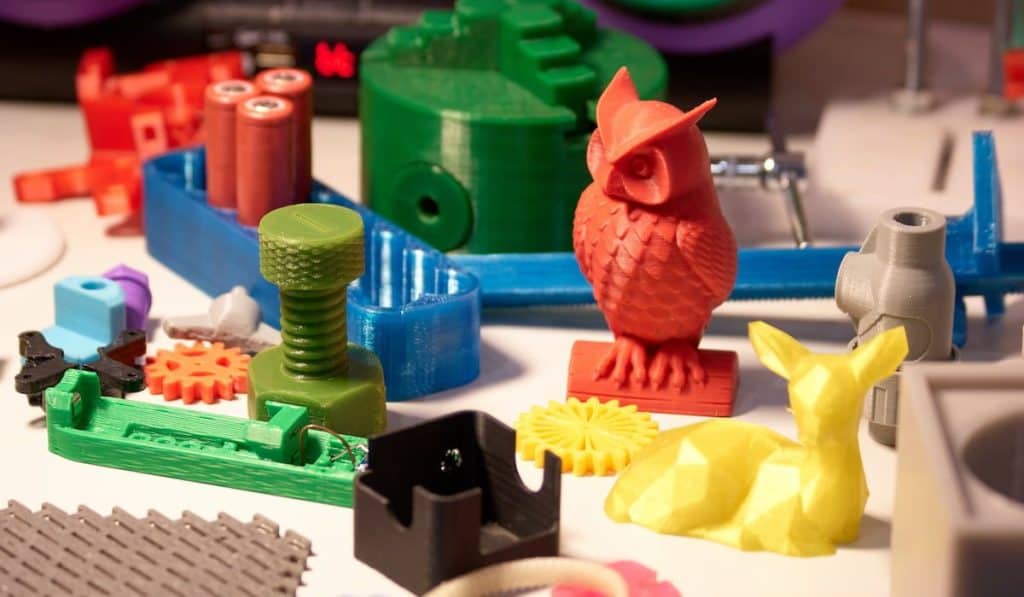 Collection of bright colorful objects printed on a 3d printer.