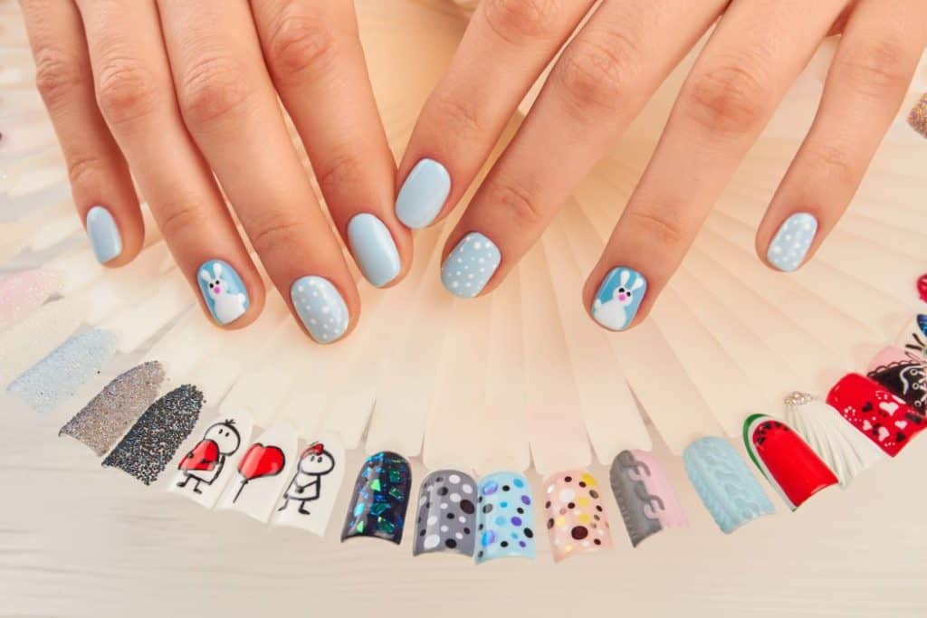 Manicured hands and nail art samples