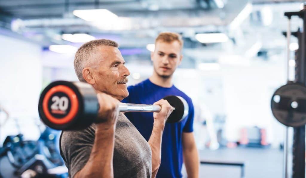 Older man lifting weights 