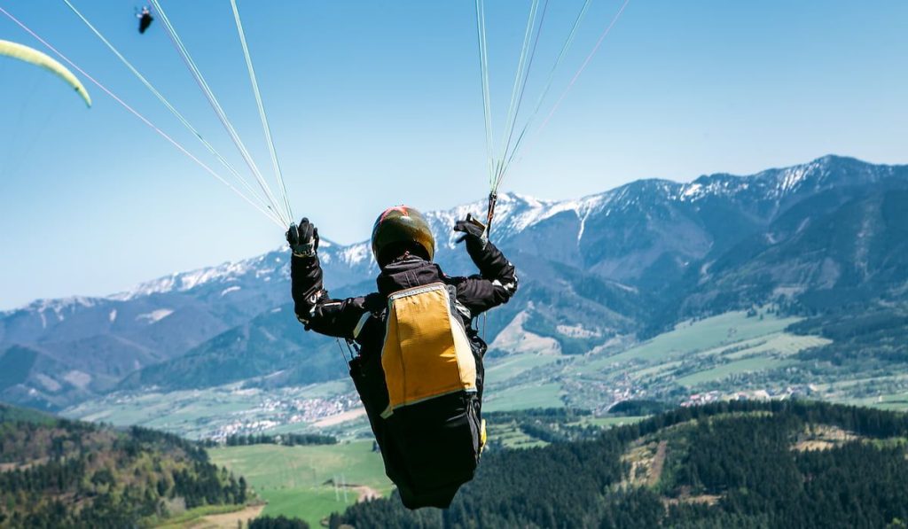 Paraglider is on the paraplane strops - soaring flight moment