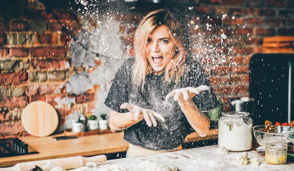 a woman having fun while baking