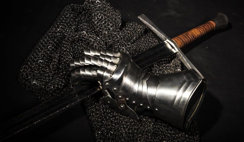 Medieval chain mail, iron gauntlet and a bastard sword