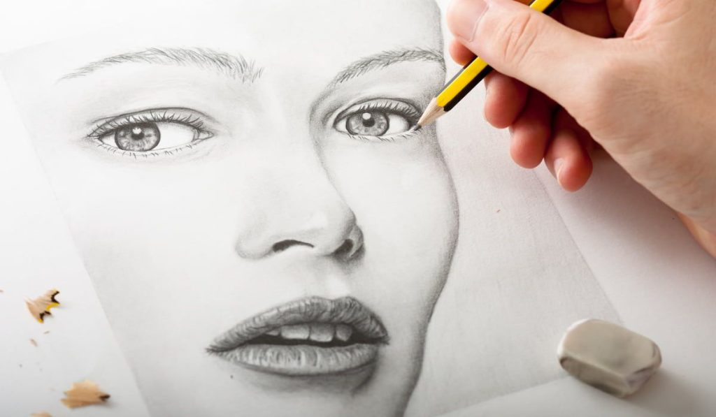 Hand Drawing a Woman Face with Pencil