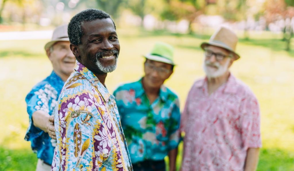 group of senior friends playing at the park