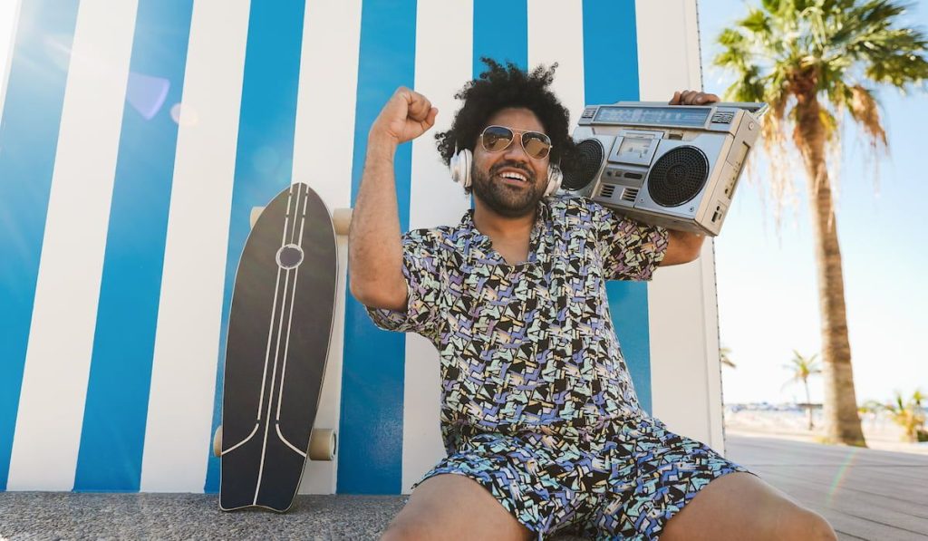 man listening music with vintage boombox stereo