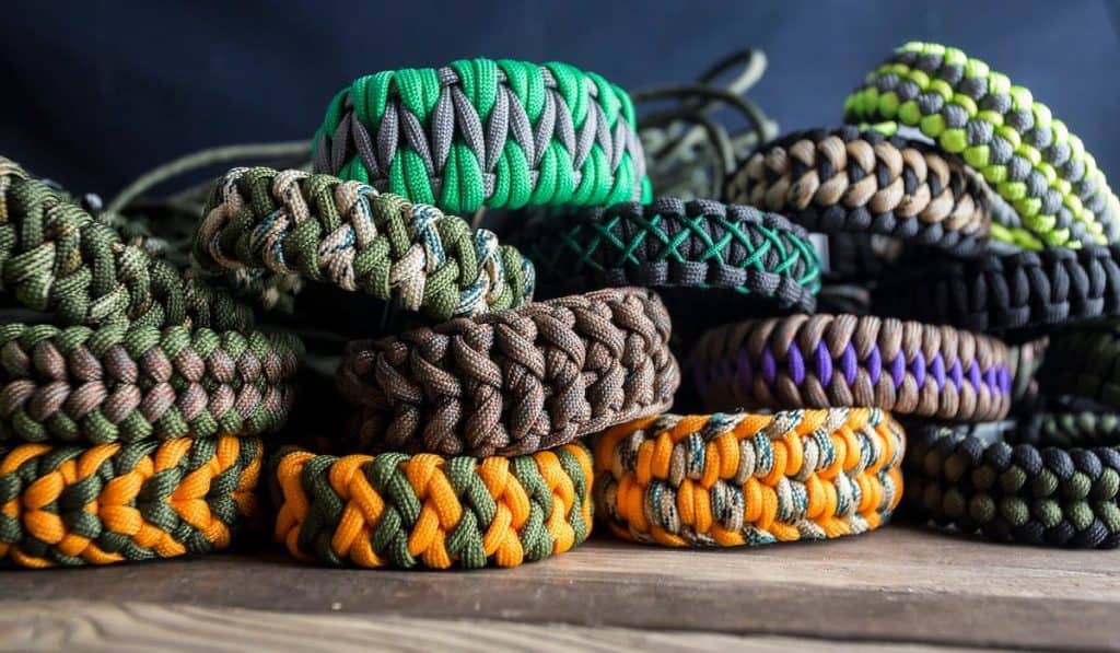 paracord bracelets on wooden background