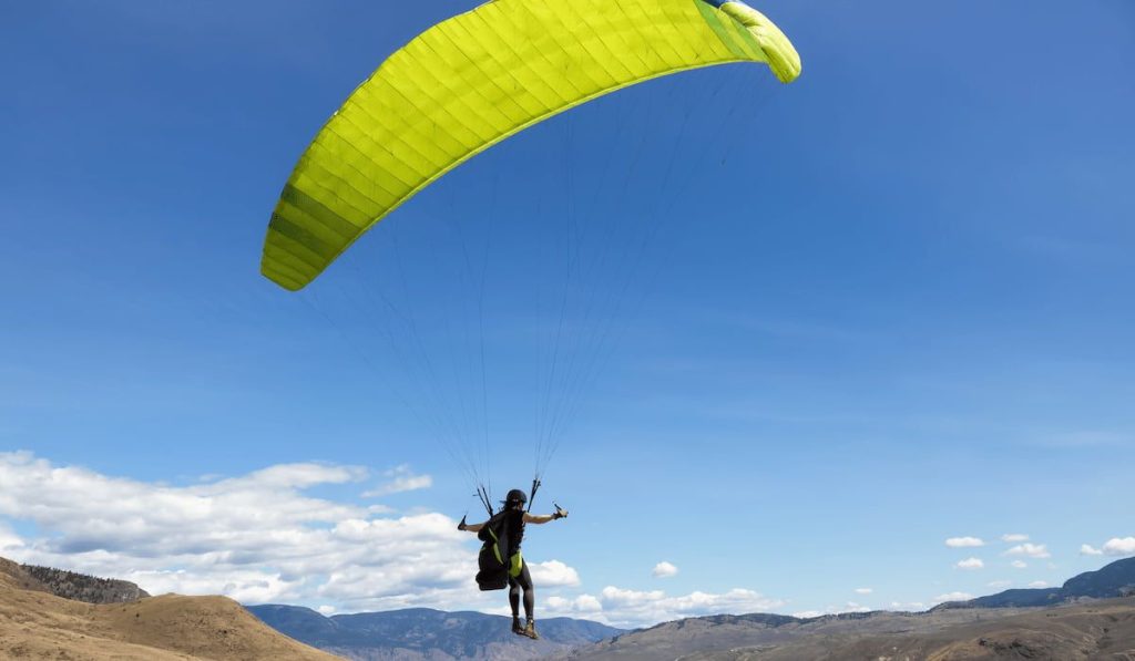 Adventurous Woman Learning to fly a Paraglider