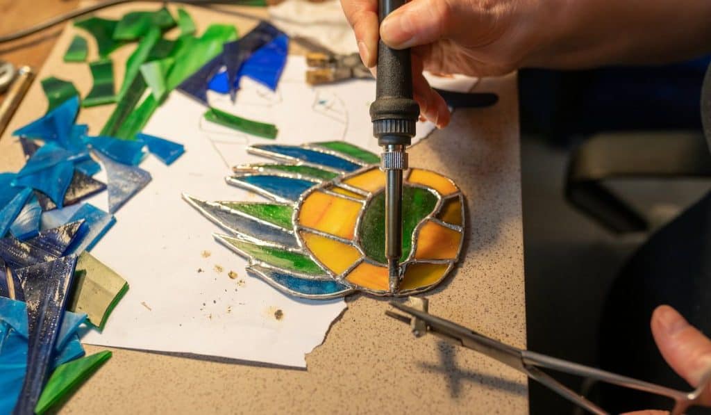 making stained glass, peacock feather shaped stained glass