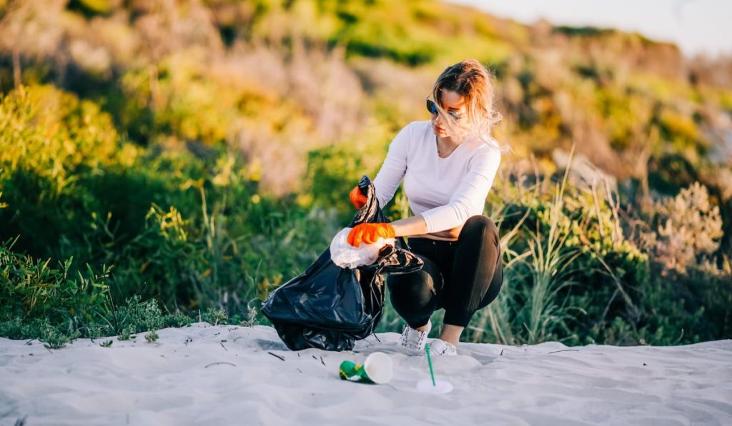 a woman volunteer to clean the beach