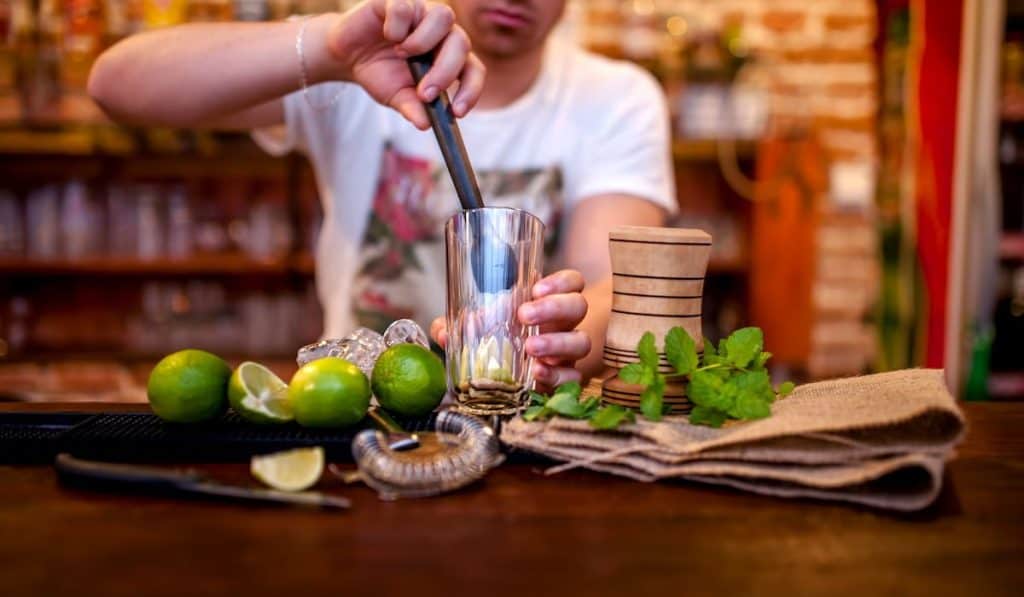 preparing mojito cocktail drink