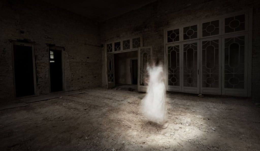 Ghost girl in white dress appears in an old room
