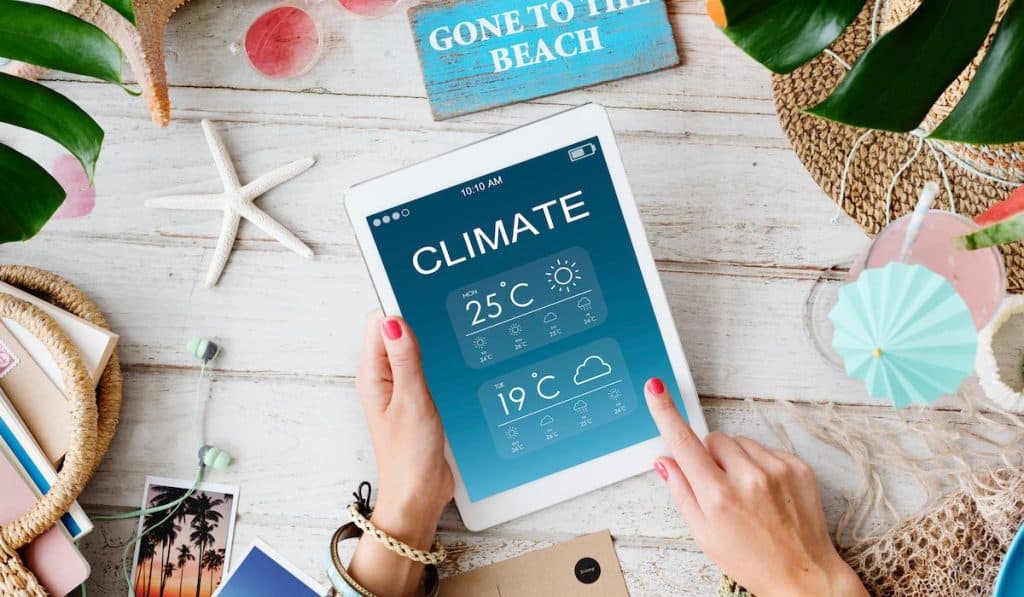 woman checking the climate on her iPad

