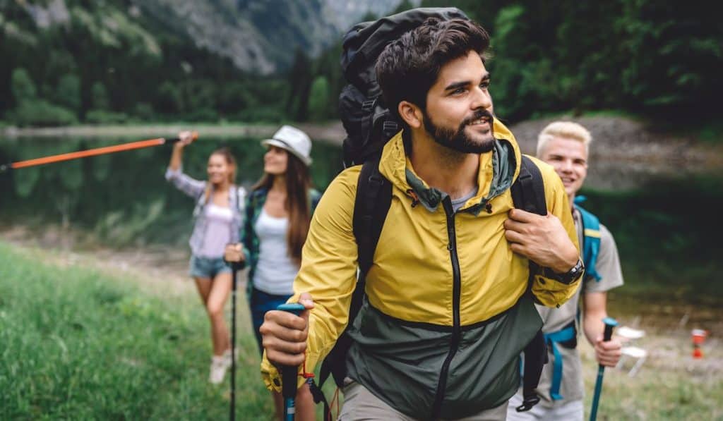 Group of friends on a hiking, camping trip in the mountains