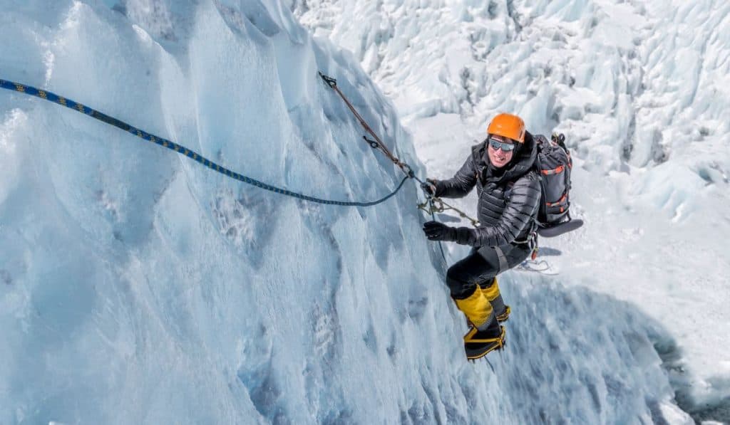 Mountaineers climbing on icefall in Nepal Everest