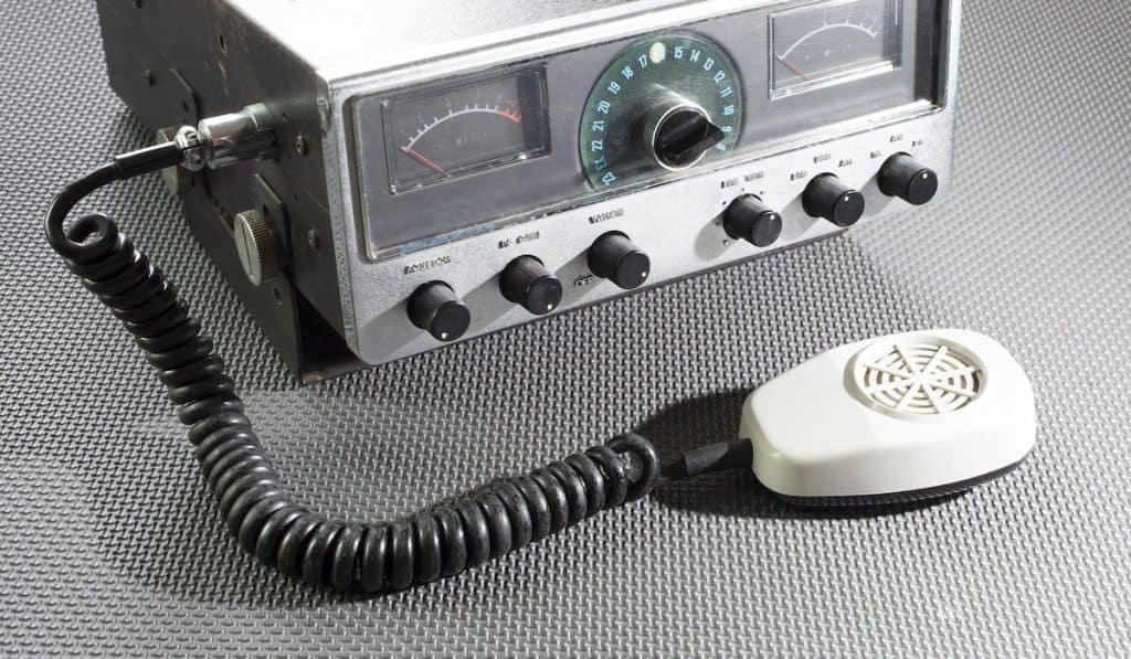 Old citizens band radio with a microphone on a rubber mat