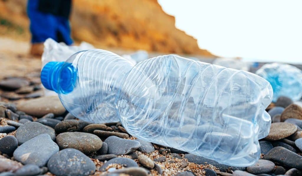 Plastic bottle trash left on a beach
