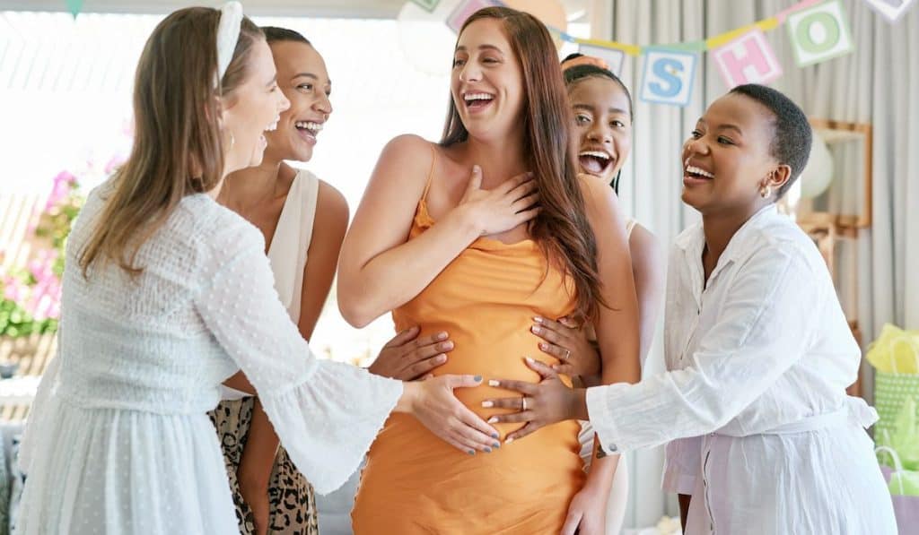 group of friends celebrating at a baby shower