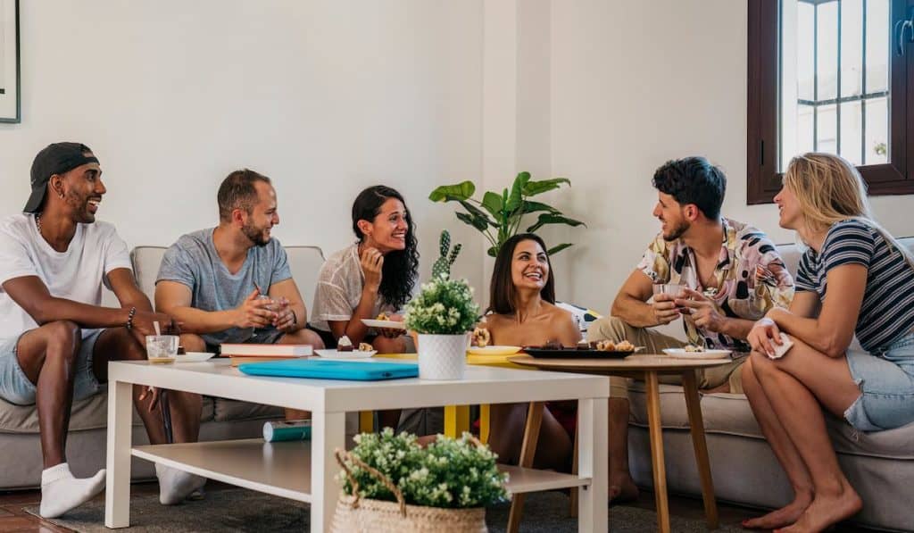 interracial group of friends celebrate an afternoon snack