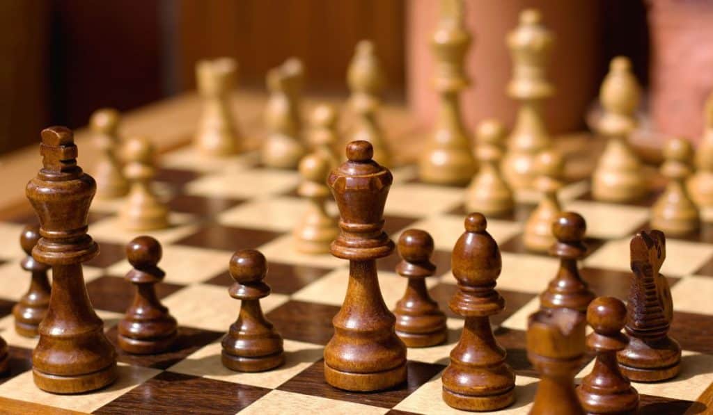 wooden chess pieces on a chessboard