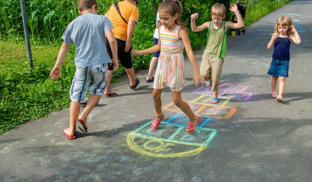 Children playing Hopscotch on the street