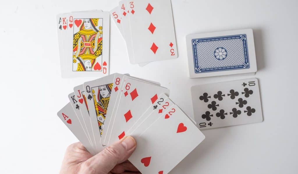 Gin Rummy the winning hand with the deck , discard pile and second player cards