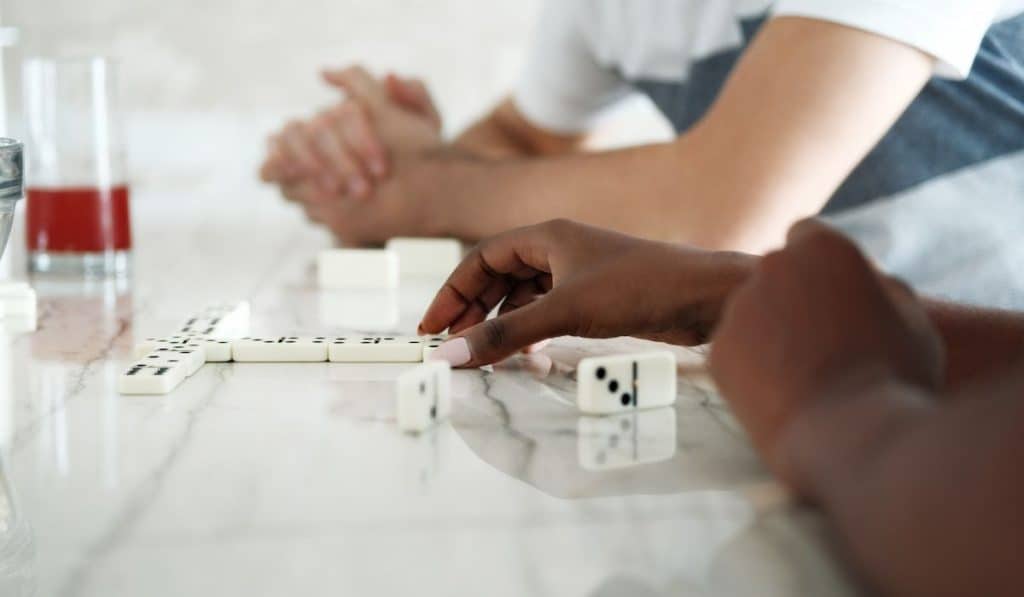 Couple Playing Domino At Home